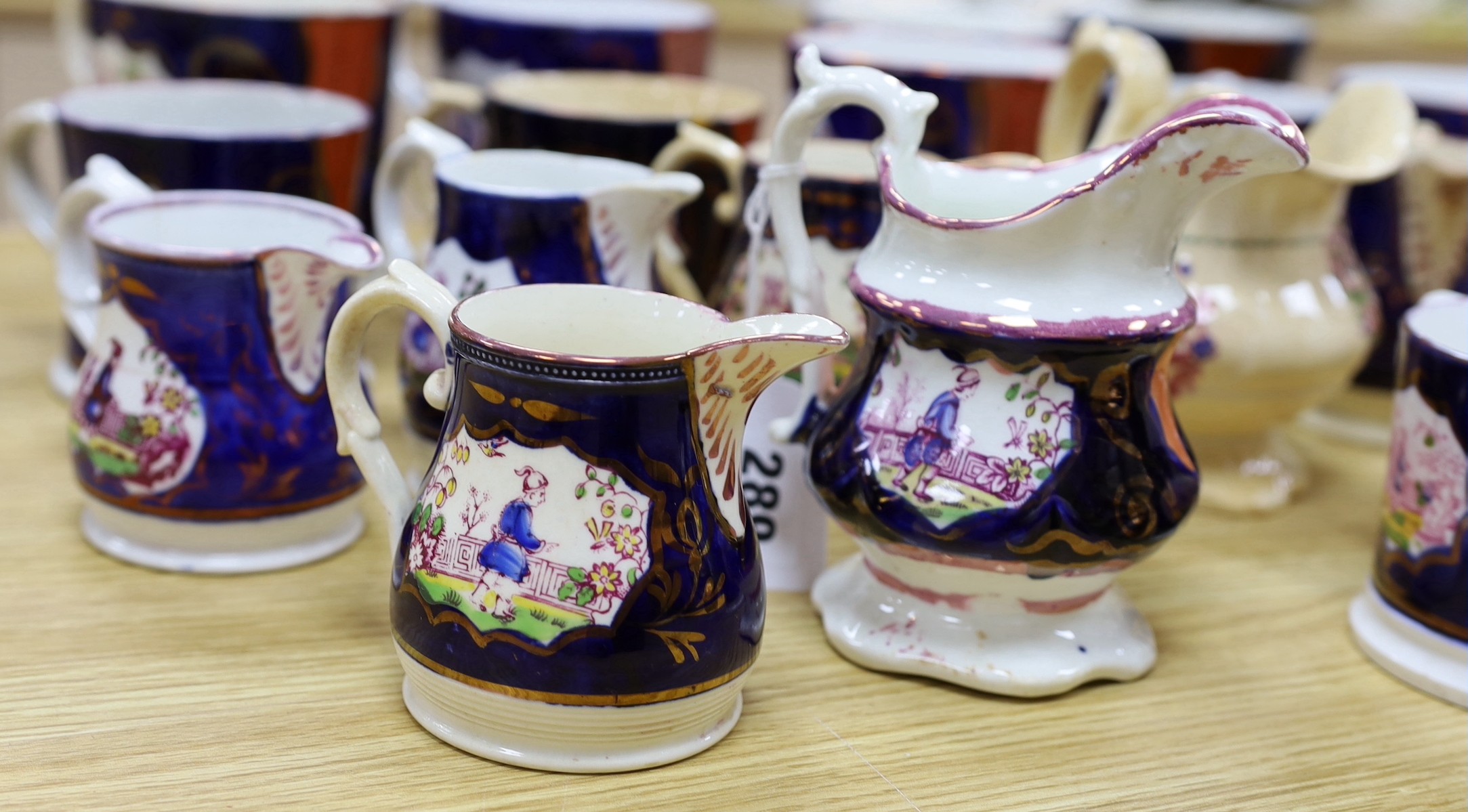 A quantity of Gaudy Welsh lustre jugs and mugs with chinoiserie motifs